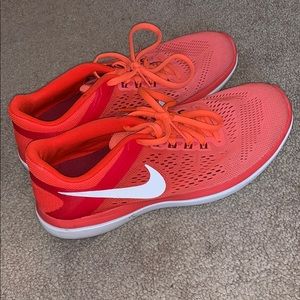 Orange Nike shoes